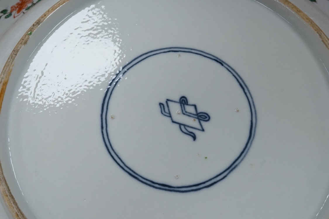 A near pair of Samson famille verte powder blue dishes in Chinese export style, each painted with a pheasant flying above blossoming branches and rocks, the border set with eight floral cartouches, underglaze blue ribbon